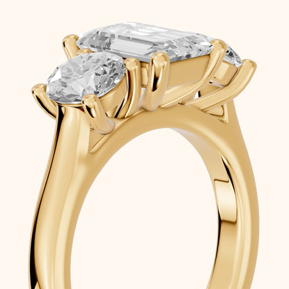 Callie Three-Stone Trellis Emerald Diamond Ring in Yellow Gold - slant-view.webp