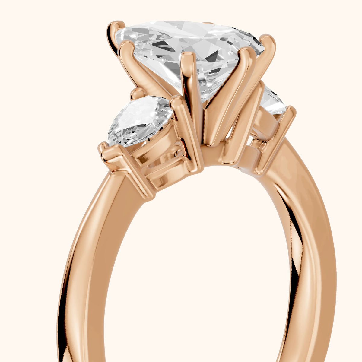 Amabel Three-Stone Pear Diamond Engagement Ring in Rose Gold - slant-view.webp