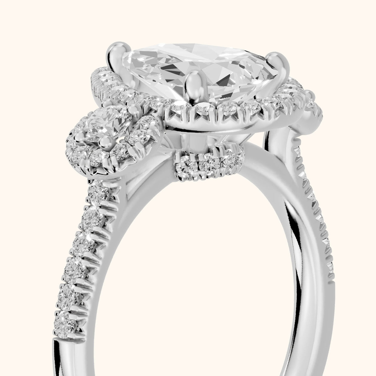 Denver Three-Stone Halo Pear Diamond Engagement Ring in White Gold - slant-view.webp