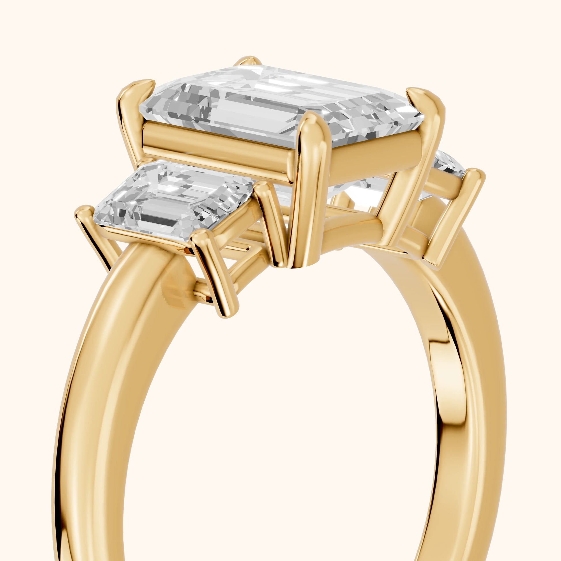 Zoe Three-Stone Emerald Diamond Ring in Yellow Gold - slant-view.webp