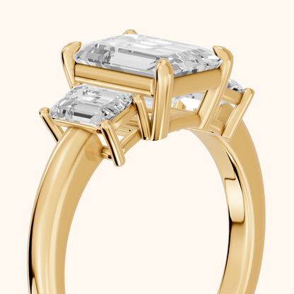 Zoe Three-Stone Emerald Diamond Ring in Yellow Gold - slant-view.webp