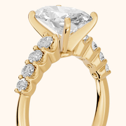 Augusta Graduated Pavé Oval Diamond Engagement Ring in Yellow Gold - slant-view.webp