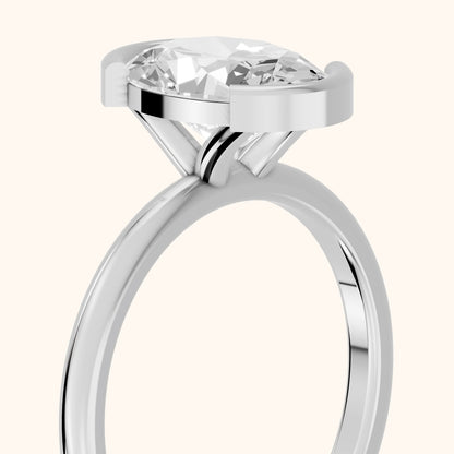 Bedford Half Bezel Solitaire Oval Diamond Engagement Ring in Platinum - slant-view.webp