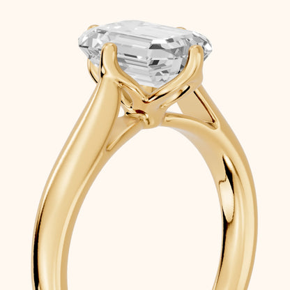 Edwina Crossover Solitaire Emerald Diamond Engagement Ring in Yellow Gold - slant-view.webp