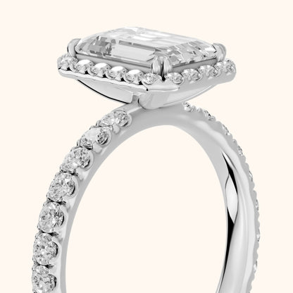 Chloe Halo Pavé Emerald Diamond Ring in Platinum - slant-view.webp