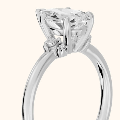 Wynne Cluster Pear Diamond Engagement Ring in Platinum - slant-view.webp