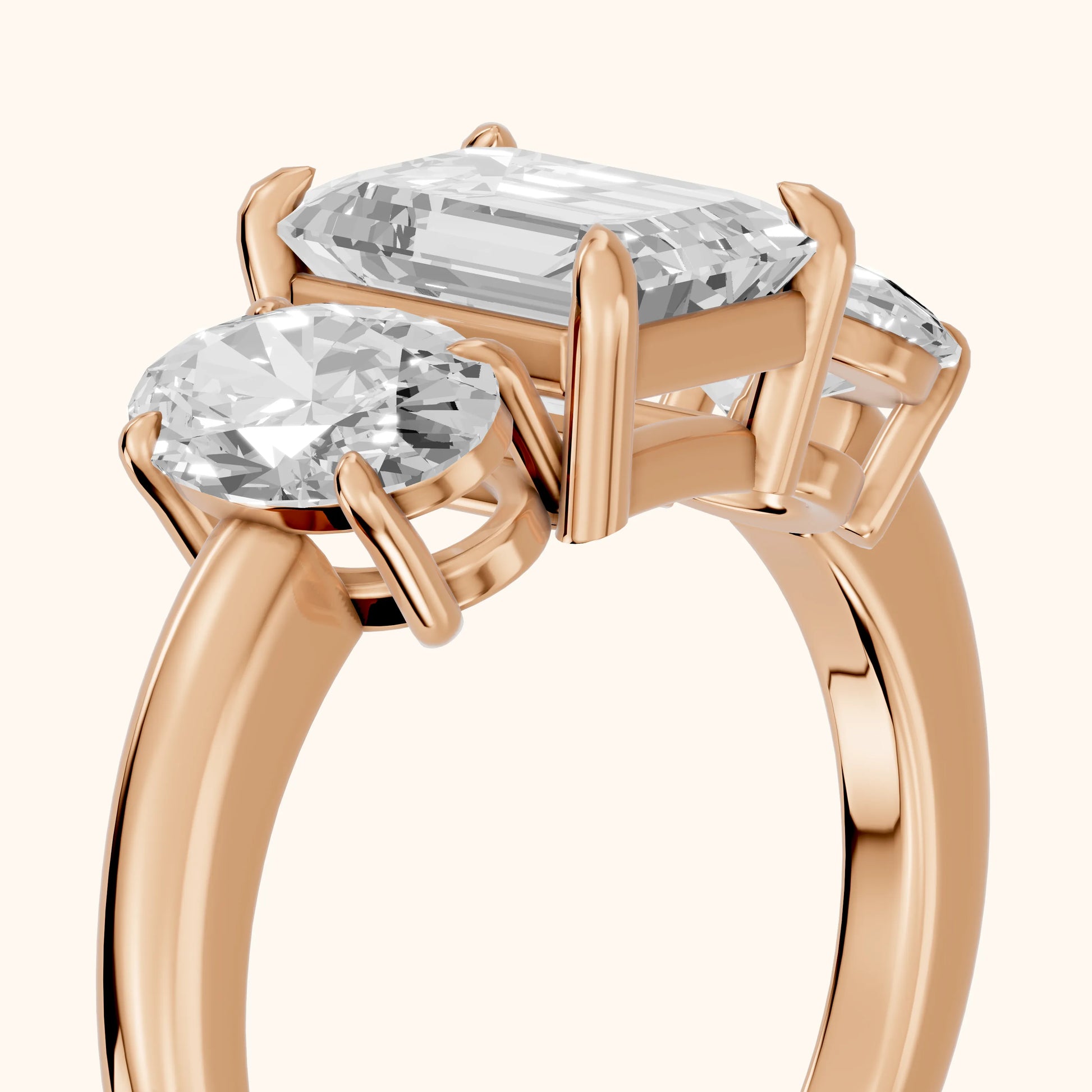 Lila Three-Stone Emerald Diamond Ring in Rose Gold - slant-view.webp