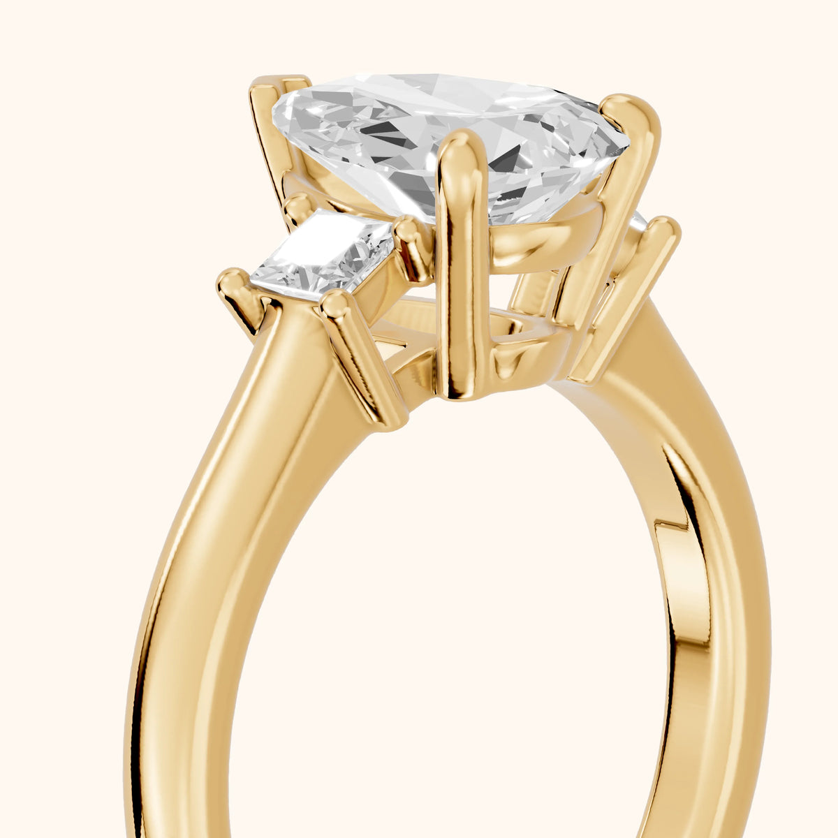 Brenna Three-Stone Pear Diamond Engagement Ring in Yellow Gold - slant-view.webp