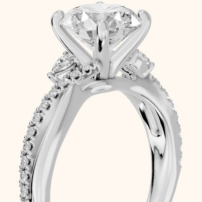 Reno Pear-Side Twist Round Diamond Engagement Ring in Platinum - slant-view.webp