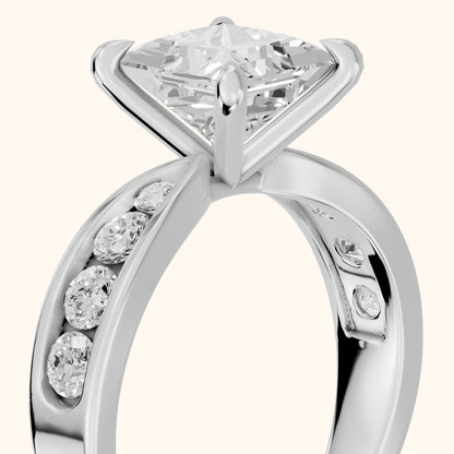 Noor Channel Set Sidestone Princess Diamond Engagement Ring in Platinum - slant-view.webp