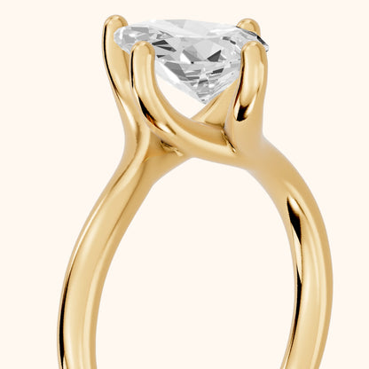Clio Bypass Solitaire Pear Diamond Engagement Ring in Yellow Gold - slant-view.webp