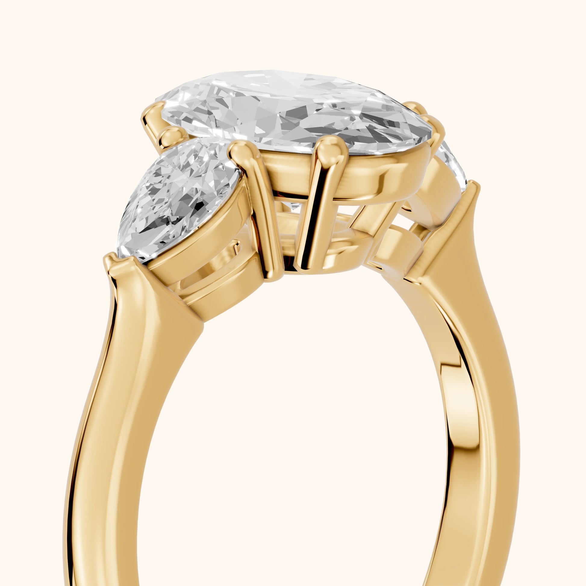 Mirabel Three-Stone Oval Diamond Engagement Ring in Yellow Gold - slant-view.webp