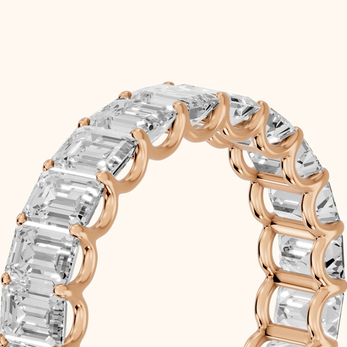 Josette Shared Prong Emerald Diamond Eternity Band in Rose Gold - slant-view