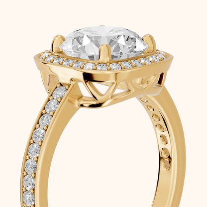 Nettie Halo Pavé Round Diamond Engagement Ring in Yellow Gold - slant-view.webp