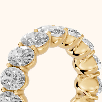 Flavia Shared Prong Oval Diamond Eternity Band in Yellow Gold - slant-view