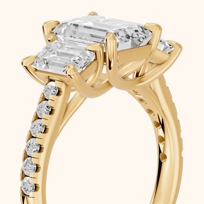 Gabrielle Three-Stone Pavé Emerald Diamond Engagement Ring in Yellow Gold - slant-view.webp