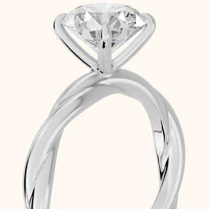 Nicola Twist Solitaire Round Diamond Engagement Ring in Silver - slant-view.webp