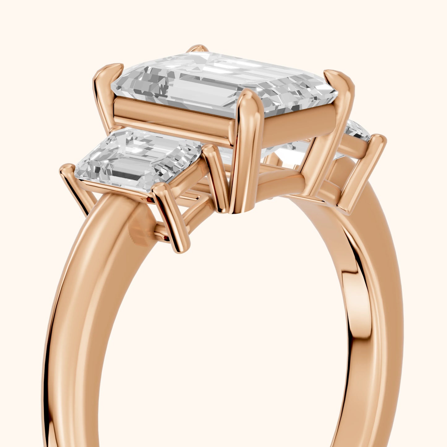 Zoe Three-Stone Emerald Diamond Ring in Rose Gold - slant-view.webp