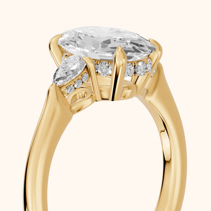 Leila Three-Stone Oval Diamond Engagement Ring in Yellow Gold - slant-view.webp