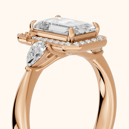 Eliza Halo Sidestone Emerald Diamond Engagement Ring in Rose Gold - slant-view.webp