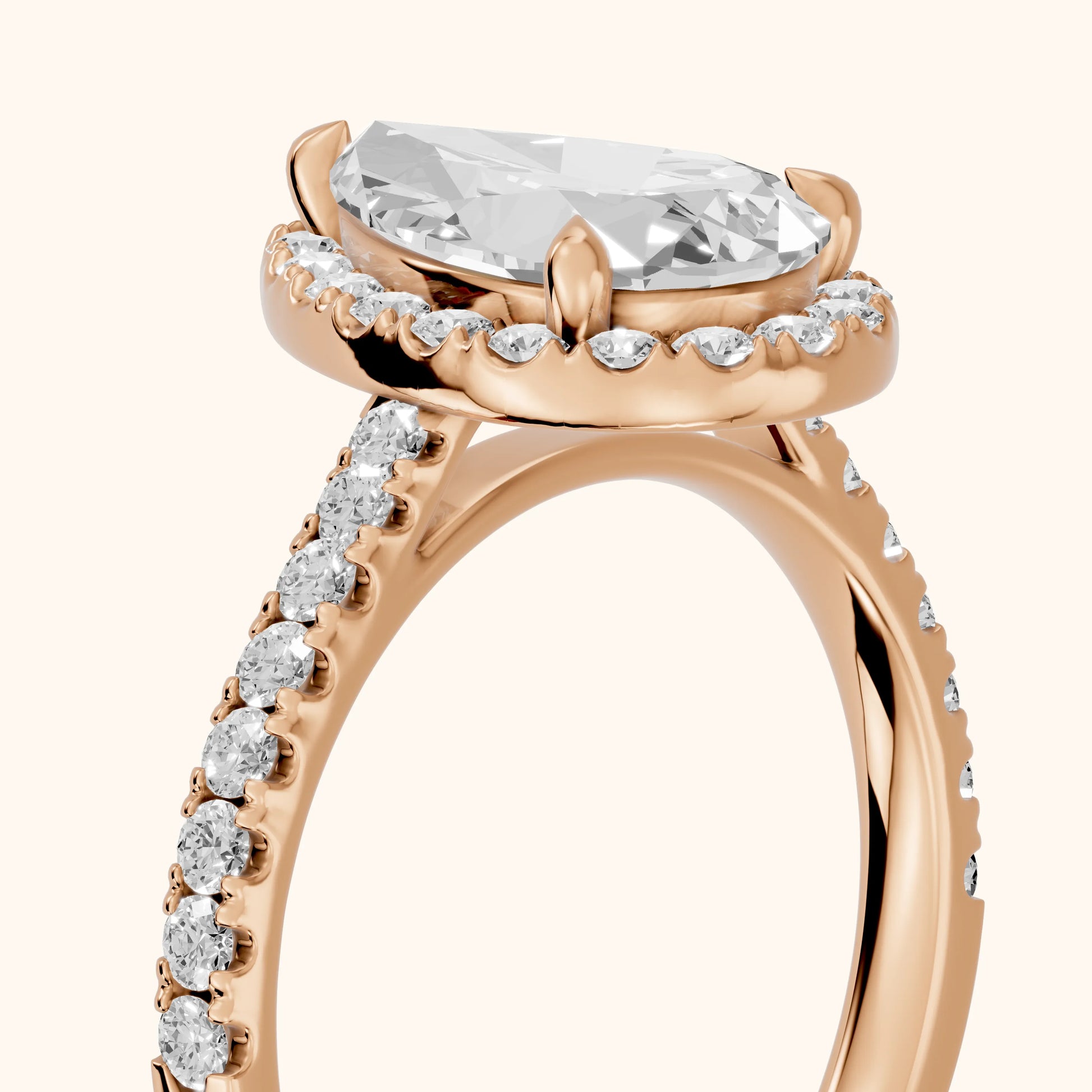 Amara Halo Claw Prong Pear Diamond Ring in Rose Gold - slant-view.webp
