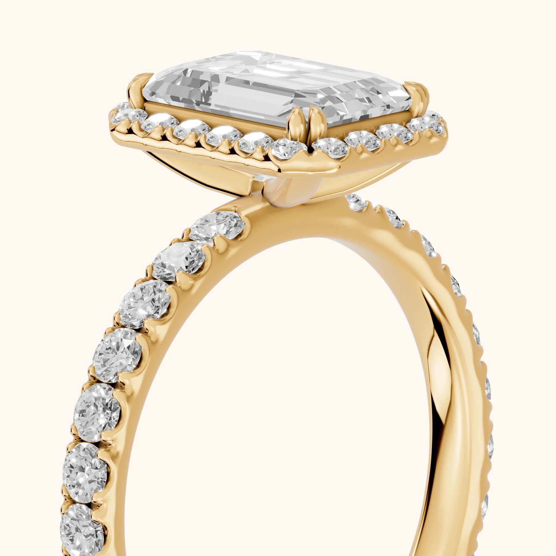 Chloe Halo Pavé Emerald Diamond Ring in Yellow Gold - slant-view.webp