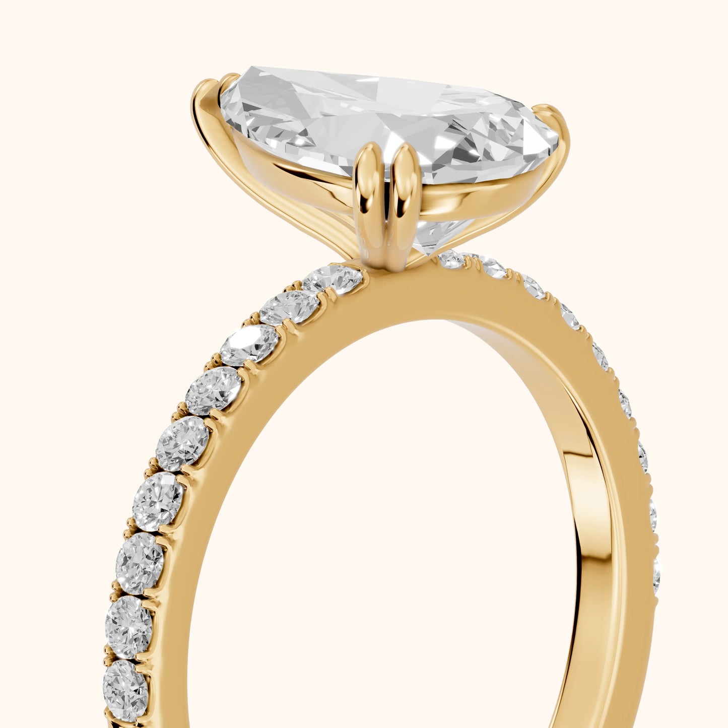 Novara Solitaire Pavé Pear Diamond Ring in Yellow Gold - slant-view.webp