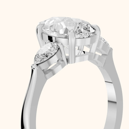 Grace Three Stone Pear Diamond Engagement Ring in Silver - slant-view.webp