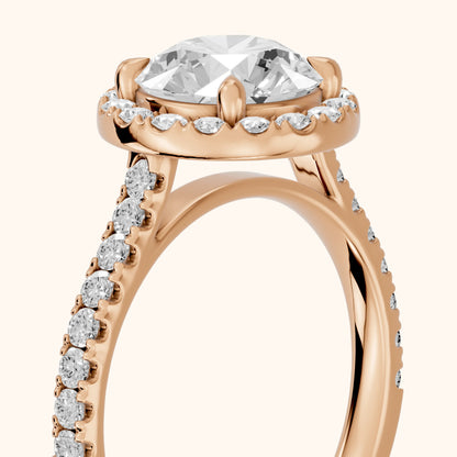 Amara Halo Claw Prong Round Diamond Ring in Rose Gold - slant-view.webp