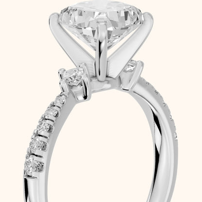 Alethea Three-Stone Pavé Cushion Diamond Engagement Ring in Platinum - slant-view.webp