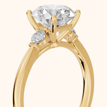 Micaela Three-Stone Round Diamond Engagement Ring in Yellow Gold - slant-view.webp