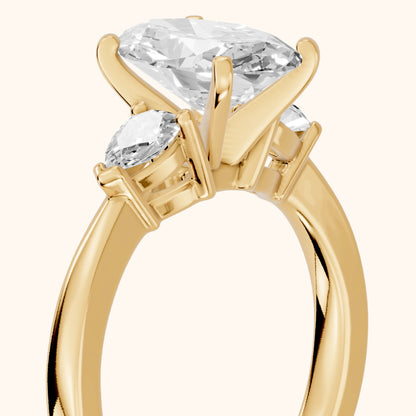 Amabel Three-Stone Oval Diamond Engagement Ring in Yellow Gold - slant-view.webp