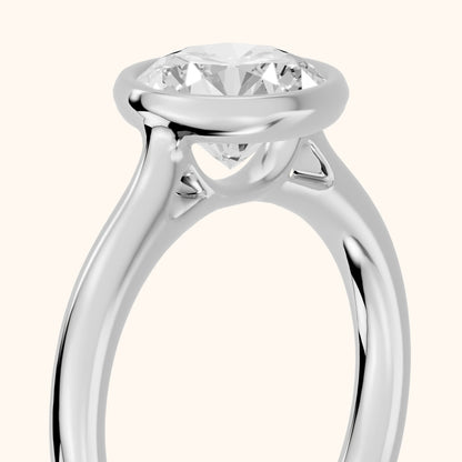 Isla Bezel Solitaire Round Diamond Engagement Ring in Platinum - slant-view.webp