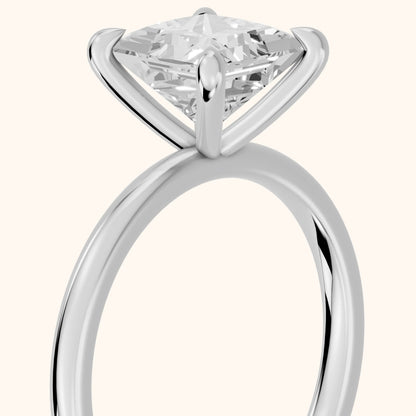 Nella Petite Solitaire Princess Diamond Engagement Ring in Platinum - slant-view.webp