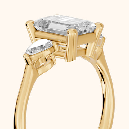 Faye Three-Stone Trellis Emerald Diamond Ring in Yellow Gold - slant-view.webp