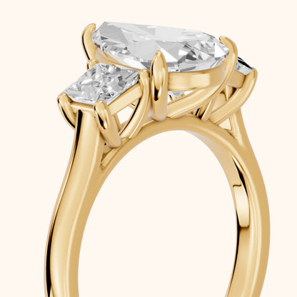 Sienna Three-Stone Pear Diamond Ring in Yellow Gold - slant-view.webp