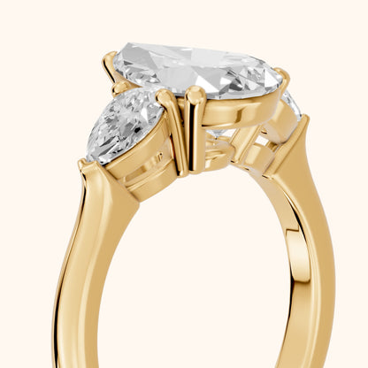 Mirabel Three-Stone Pear Diamond Engagement Ring in Yellow Gold - slant-view.webp