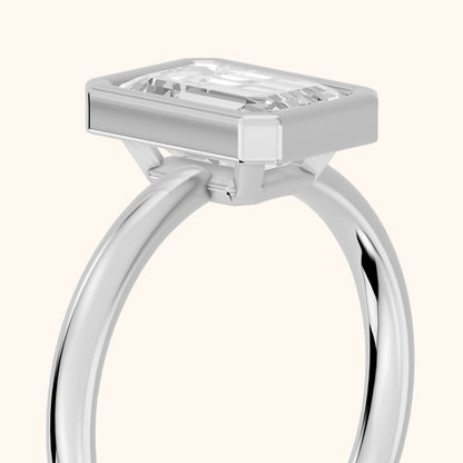 Maeve Bezel Solitaire Emerald Diamond Ring in Silver - slant-view.webp