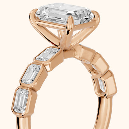 Carol Half Bezel Emerald Diamond Engagement Ring in Rose Gold - slant-view.webp