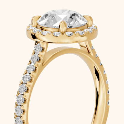 Amara Halo Claw Prong Round Diamond Ring in Yellow Gold - slant-view.webp