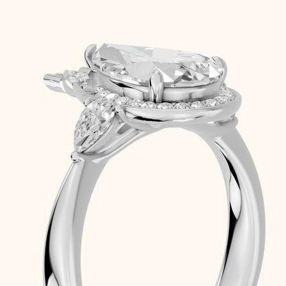Eliza Halo Sidestone Pear Diamond Engagement Ring in White Gold - slant-view.webp