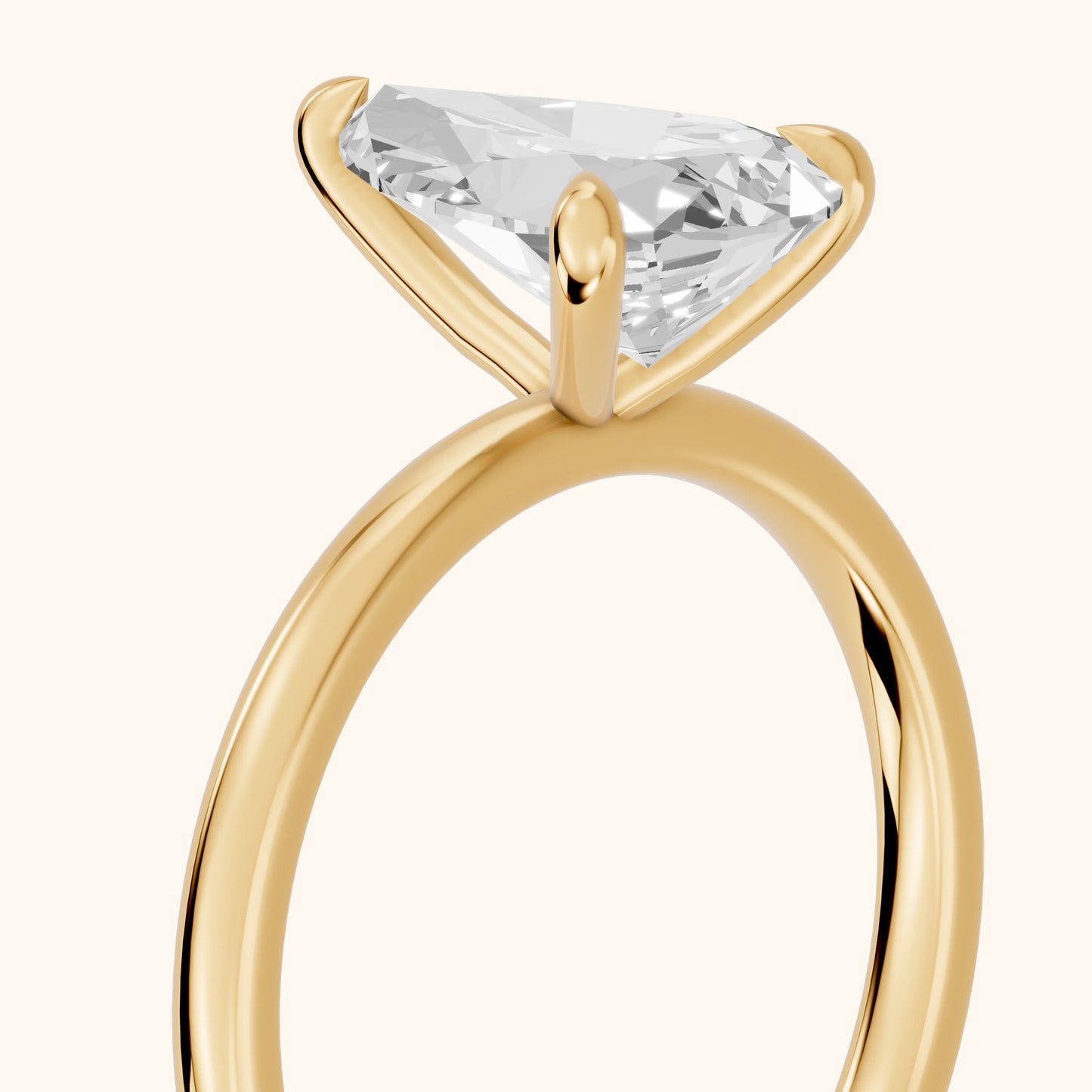 Nella Petite Solitaire Pear Diamond Engagement Ring in Yellow Gold - slant-view.webp