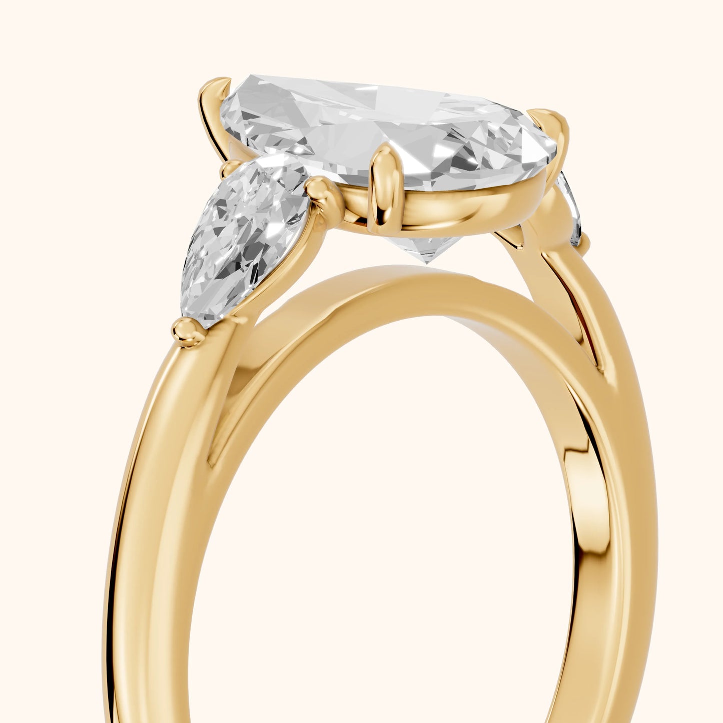 Phoebe Three-Stone Pear Diamond Ring in Yellow Gold - slant-view.webp