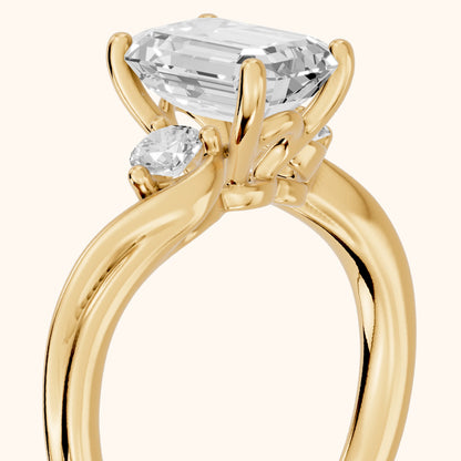 Rena Bypass Three-Stone Emerald Diamond Engagement Ring in Yellow Gold - slant-view.webp