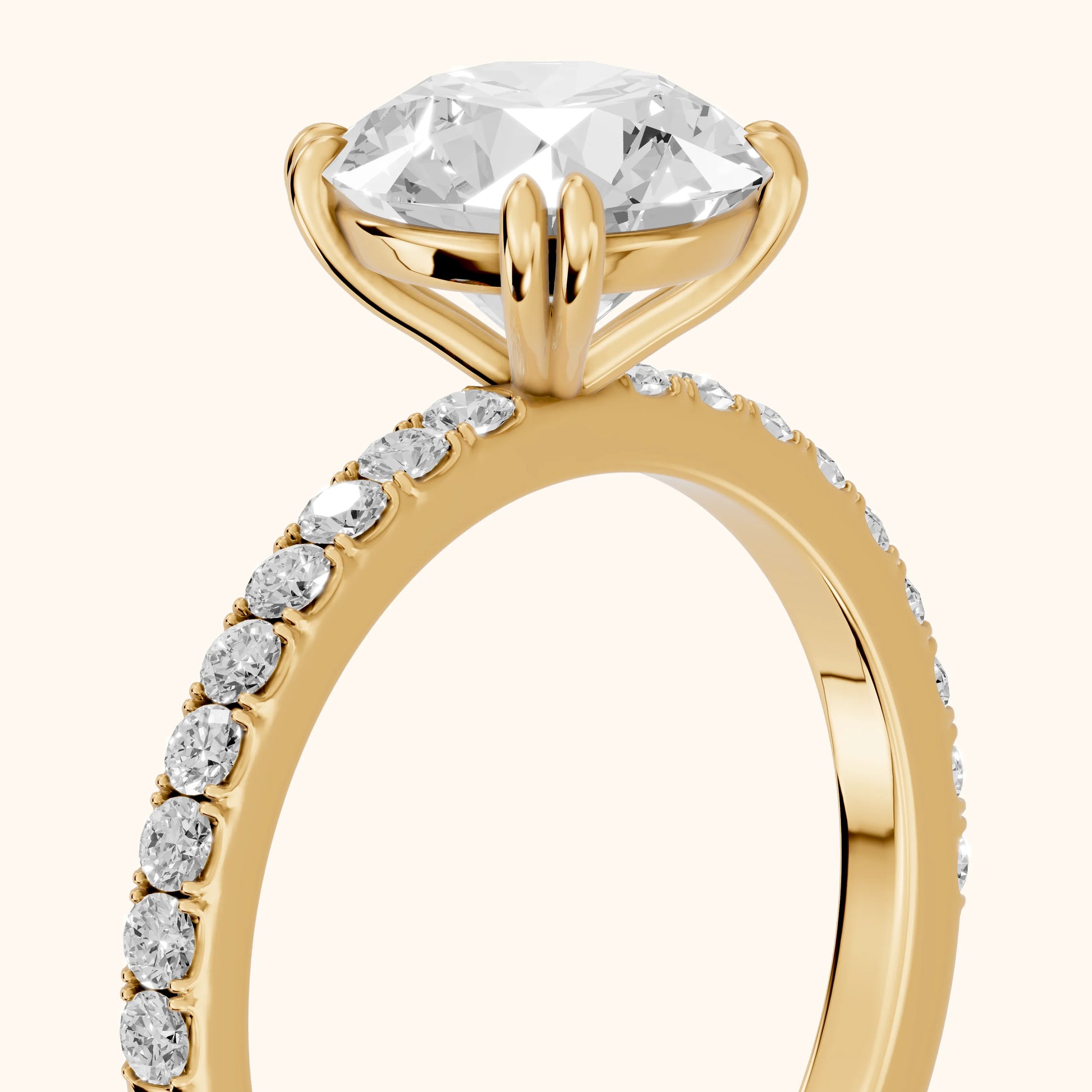 Novara Solitaire Pavé Round Diamond Ring in Yellow Gold - slant-view.webp