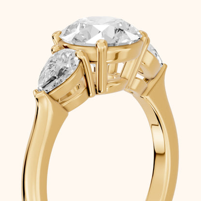 Mirabel Three-Stone Round Diamond Engagement Ring in Yellow Gold - slant-view.webp