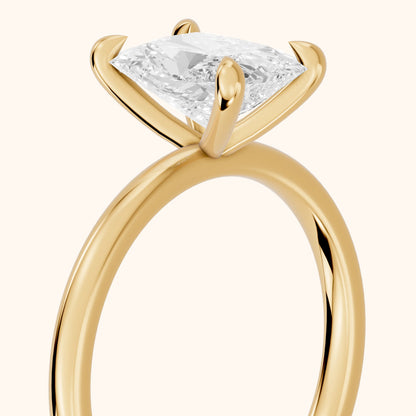 Nella Petite Solitaire Radiant Diamond Engagement Ring in Yellow Gold - slant-view.webp