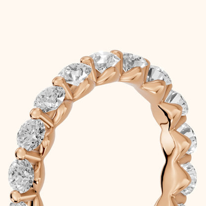 Roshni Shared Prong Round Diamond Eternity Band in Rose Gold - slant-view