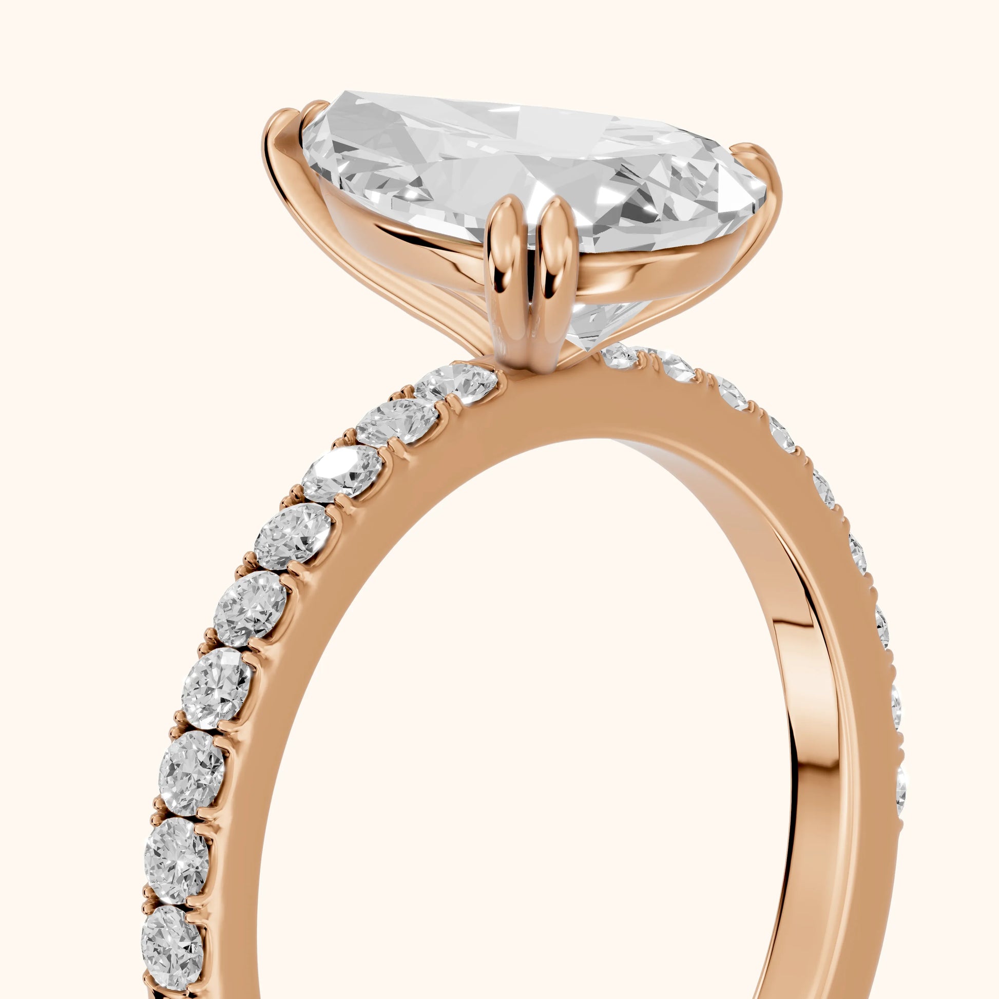 Novara Solitaire Pavé Pear Diamond Ring in Rose Gold - slant-view.webp