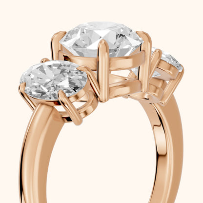 Lila Three-Stone Round Diamond Ring in Rose Gold - slant-view.webp